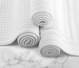 An image of the complete collection of Artesano cotton bath rugs.