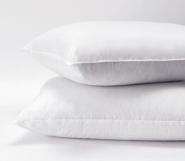 Stack of two polyester pillows. The Express pillow is a wholesale pillow that the budget-minded property will appreciate.