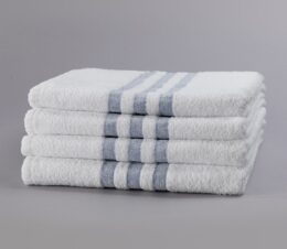 A stack of 4 hospital towels with a 3-Stripe design are pre-laundered, eliminating the need for up-front processing.