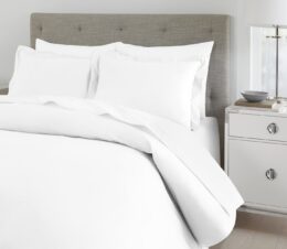 A Centium Satin duvet cover is so smooth and silky, it’s the preferred choice of many 5-star hotels. Discover what hoteliers love about this sateen duvet cover. Shown here: a detail shot of a duvet cover on a bed.