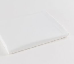 Standard Mill Percale healthcare sheeting for hospitals and health systems. Shown folded.